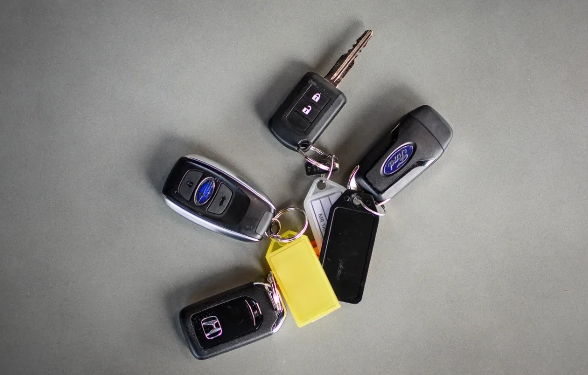 Triton Locksmith cutting car key at customer location in Delray Beach FL